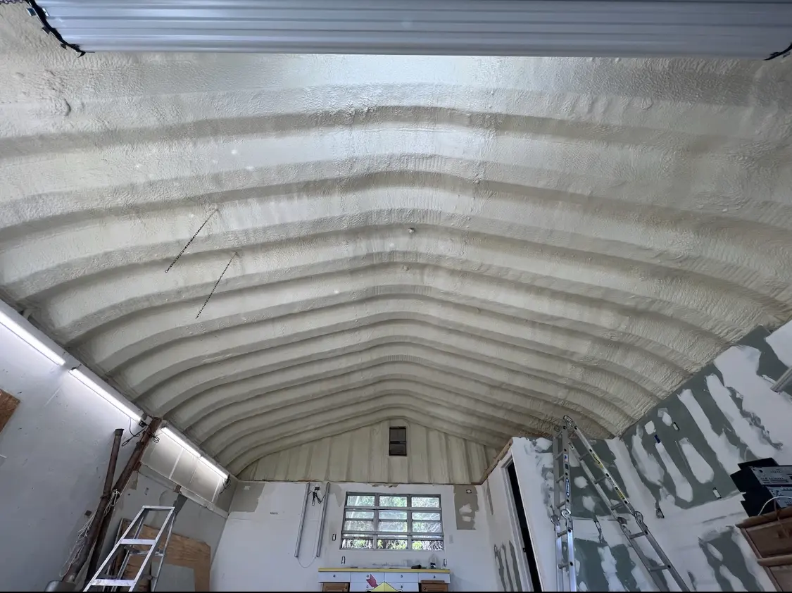 Spray polyurethane foam applied to the underside of a metal roof deck in Blackhawk
